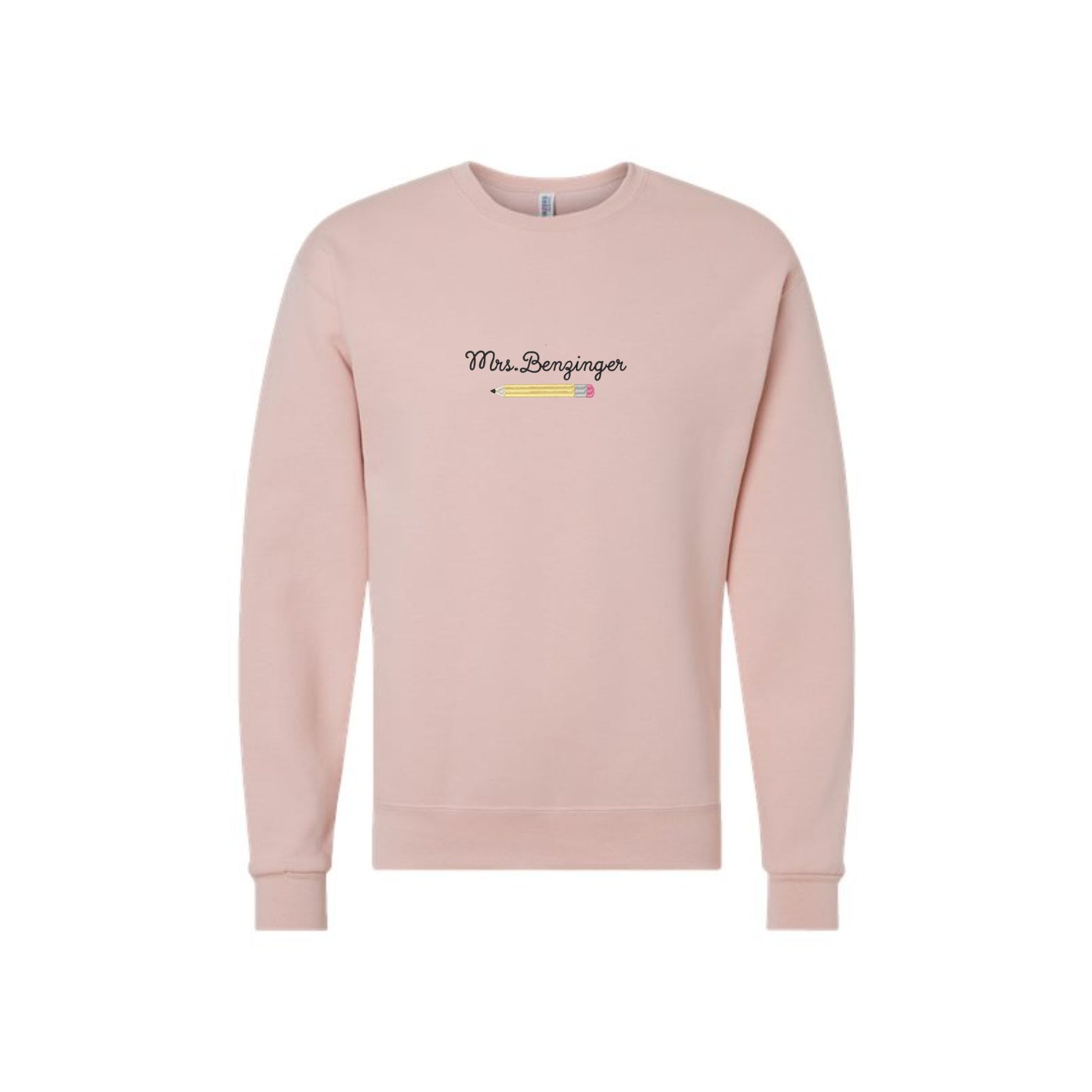 a blush crewneck sweatshirt with a custom name embroidered over an embroidered pencil icon on the center front of the shirt