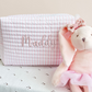 pink and white striped quilted travel pouch with jelly font name embroidery in mauve thread
