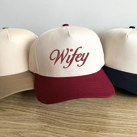 beige, burgundy, and black two tone vintage trucker hat with custom embroidered wifey design