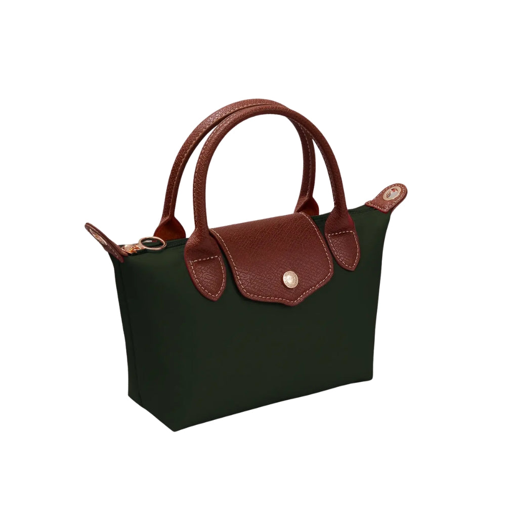 A dark green canvas handbag with brown leather handles, trim, and flap closure, featuring a gold-tone snap button and hardware, shown on a plain white background.
