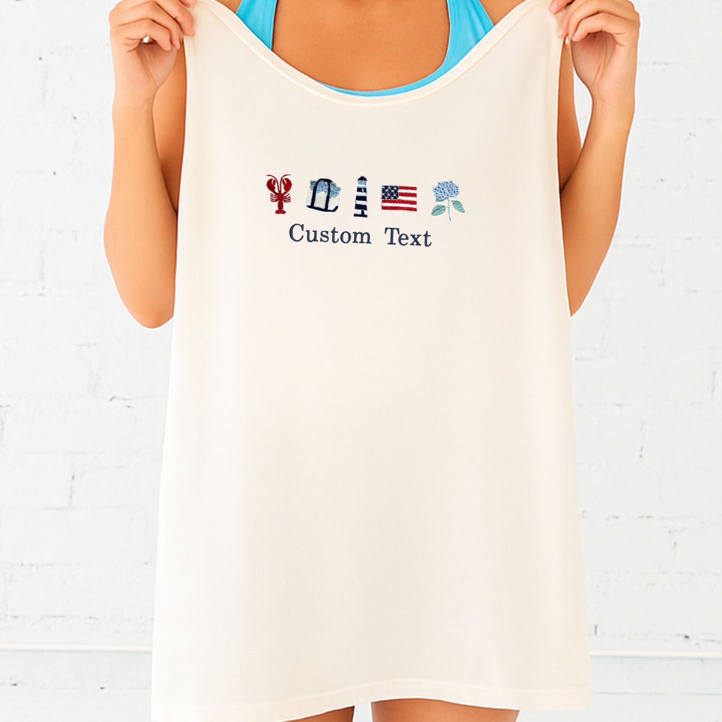 Woman holding an ivory tank top with customizable text and icons on a light background