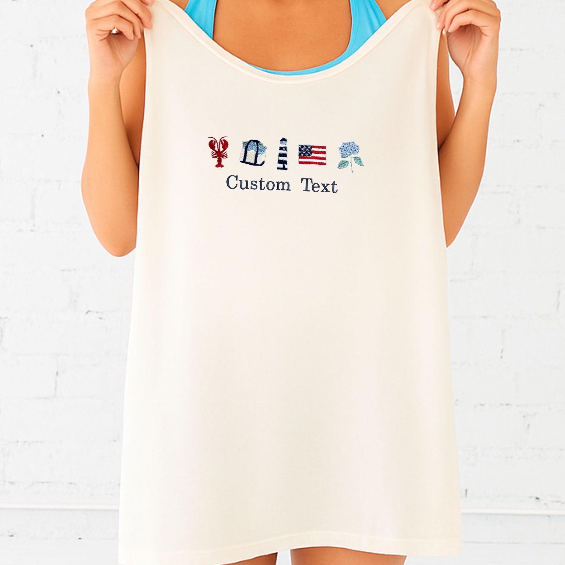 Woman holding an ivory tank top with customizable text and icons on a light background