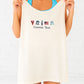Woman holding an ivory tank top with customizable text and icons on a light background