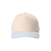 Beige cap with a blue and white checkered brim on a white background