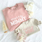 Coordinating mommy and mini sweatshirts in blush pink and heather oat with custom merry prints