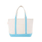 Natural tote bag with baby blue trim on a white background