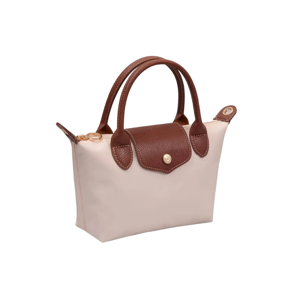 A small structured handbag with a light beige body and dark brown leather handles, trim, and front flap closure, shown on a plain white background.