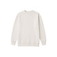 A plain crewneck sweatshirt in a warm off-white or cream color, displayed flat against a solid white background.
