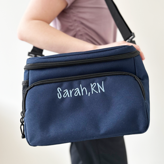 woman with lunch bag over her shoulder with a custom name embroidery