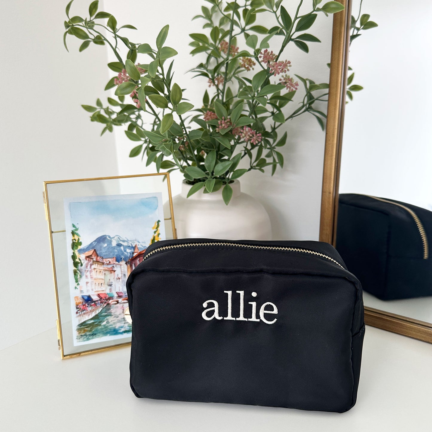 black nylon cosmetic bag with allie embroidered in white