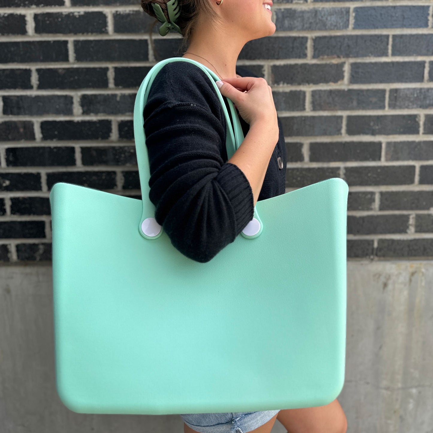 girl with a large waterproof tote over her shoulder