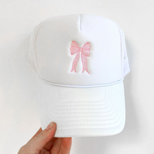 White trucker hat with embroidered baby pink bow