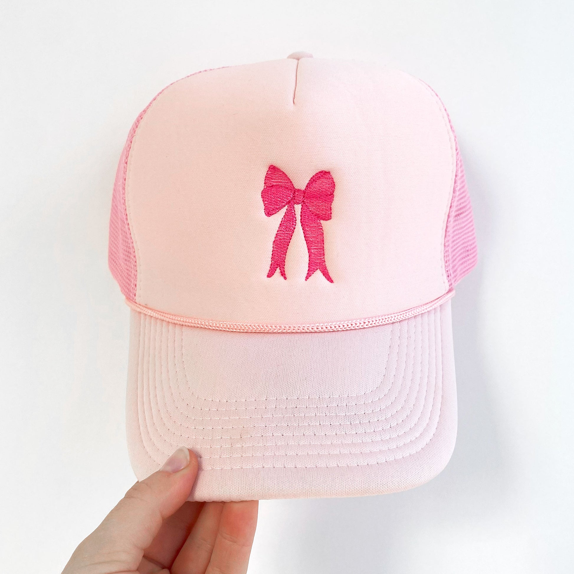 pink trucker hat with embroidered pink bow