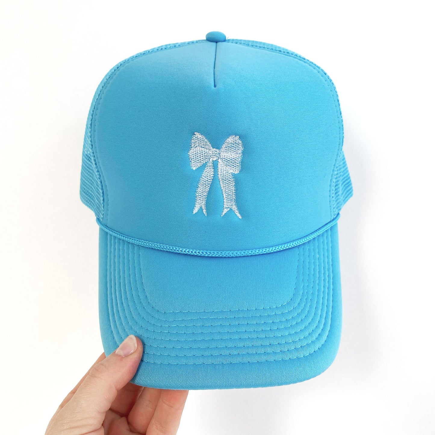 sky blue trucker hat with embroidered white bow