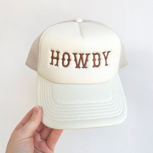 sand trucker hat with embroidered howdy text in brown thread