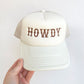 sand trucker hat with embroidered howdy text in brown thread