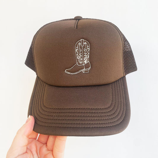 brown trucker hat with embroidered outline cowgirl boot in natural thread