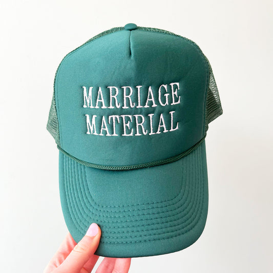 dark green trucker hat with embroidered allc aps marriage material in white thread