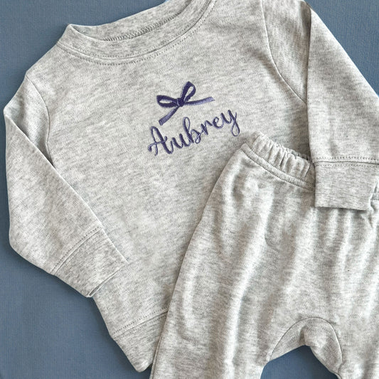 Heather grey 2 piece infant lounge set with custom bow and name embroidery on the center chest