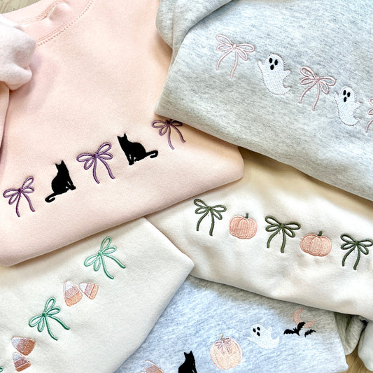 mix of crewneck sweatshirts with cute halloween and bow embroidered icons 
