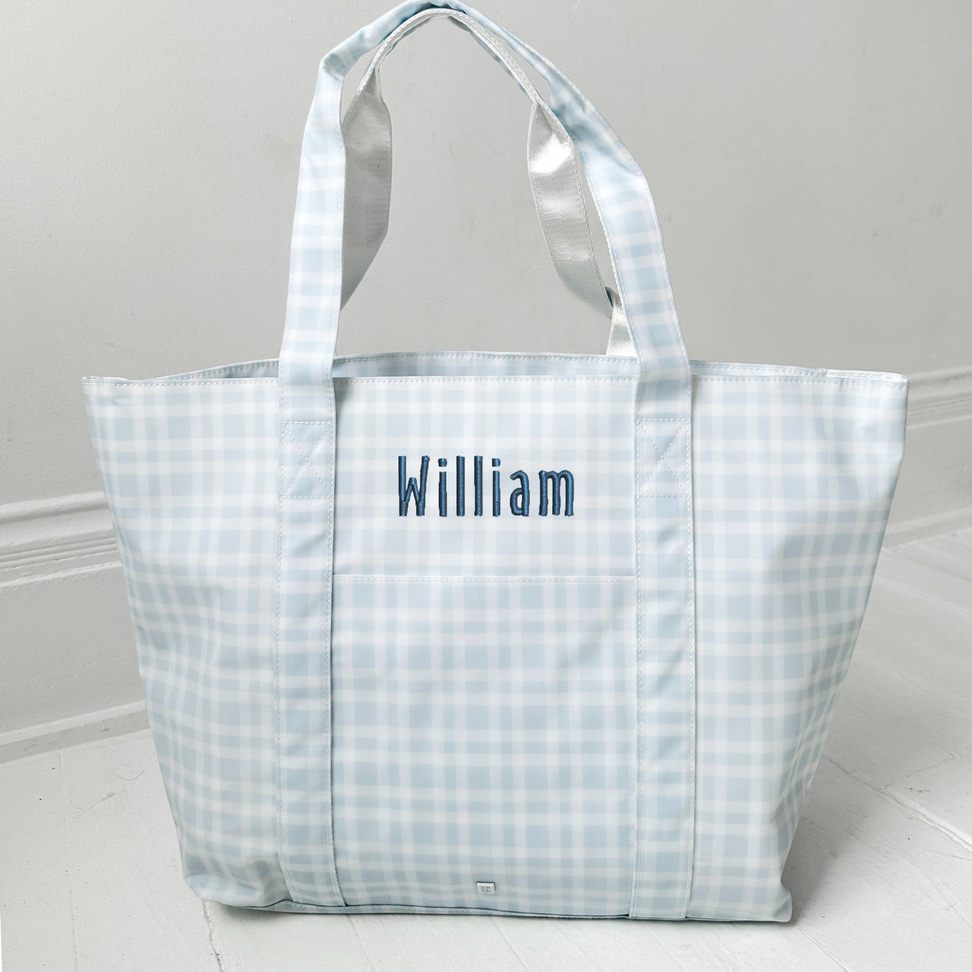 pimlico plaid blue jumbo tote with custom name embroidered in royal blue with Handicraft font