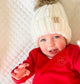 toddler wearing a  crewneck sweatshirt with stitched heart and initial design on the left chest