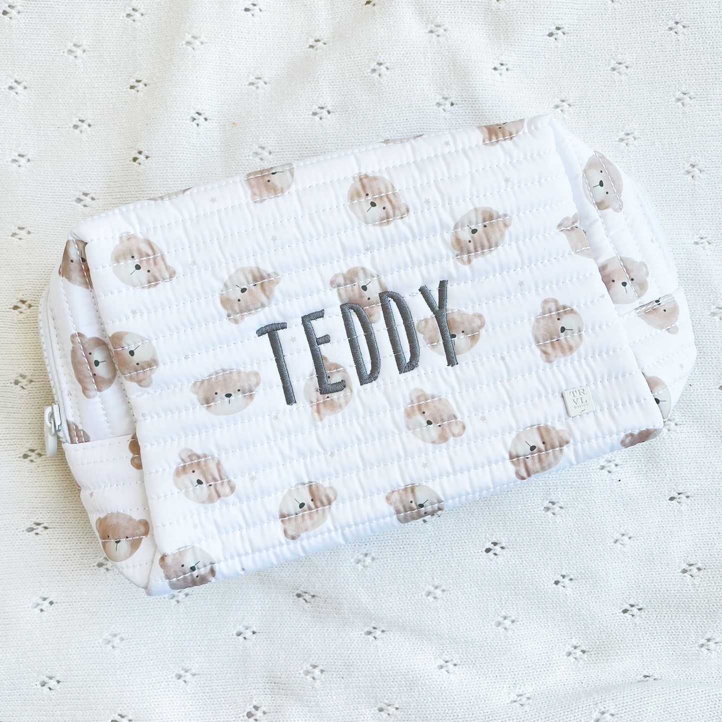 front image of quilted children's pouch with teddy bear pattern and name embroidery
