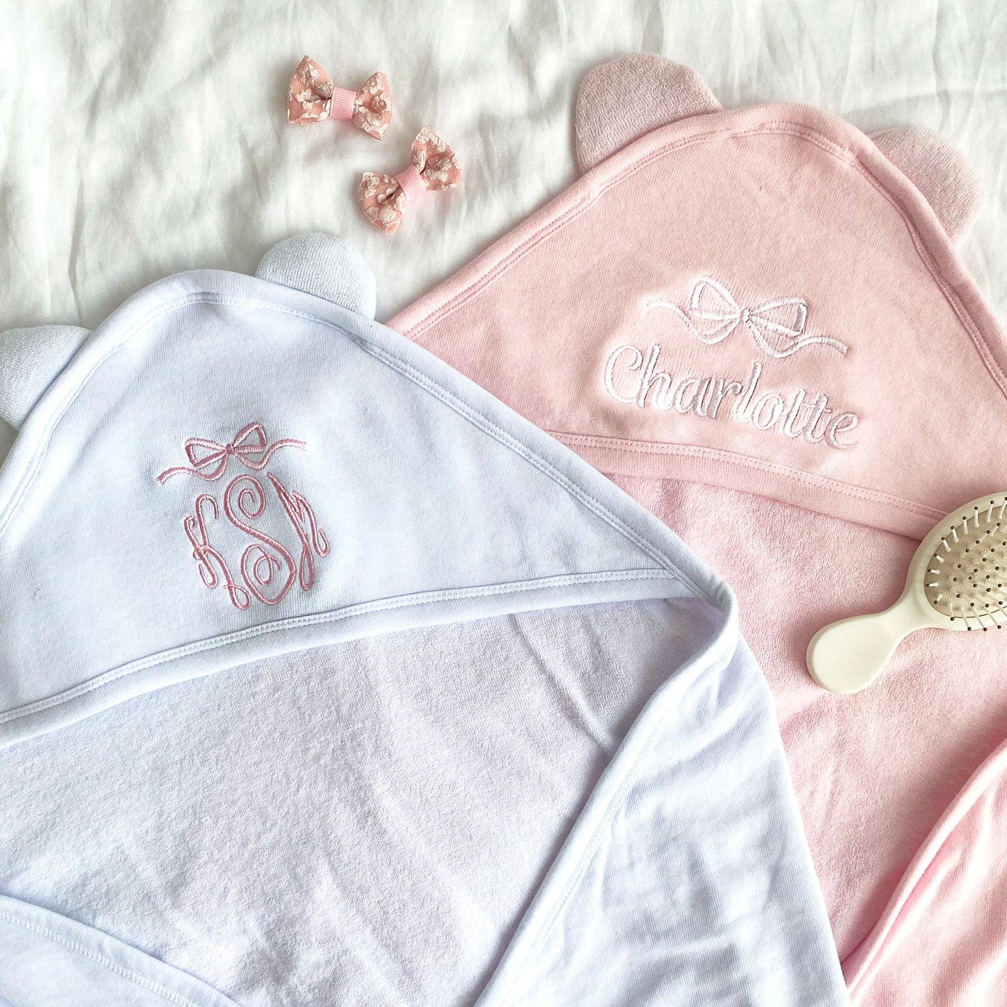 Pink and White hooded baby towels with full name and monogram options with bow embroidered above