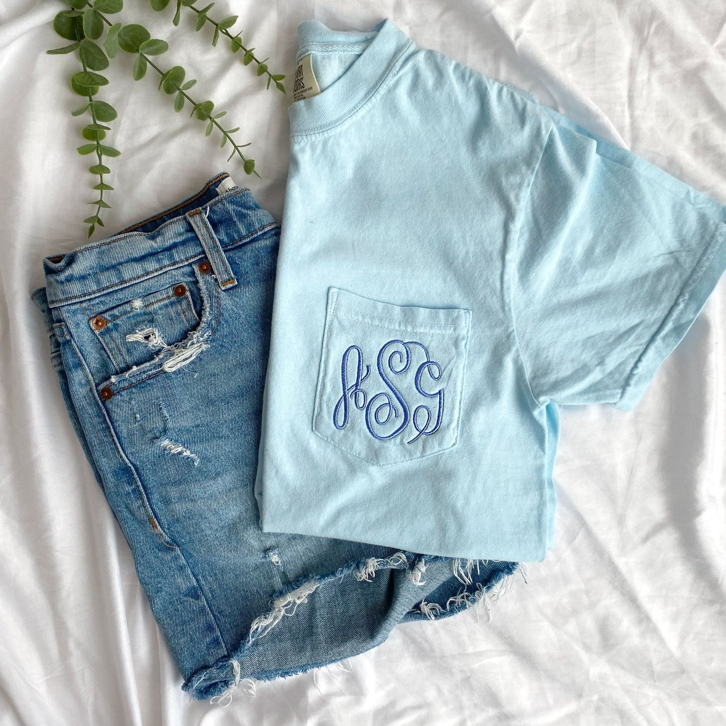 Jeans shorts styled with a chambray comfort colors tee with monogram embroidered on the pocket in periwinkle thread