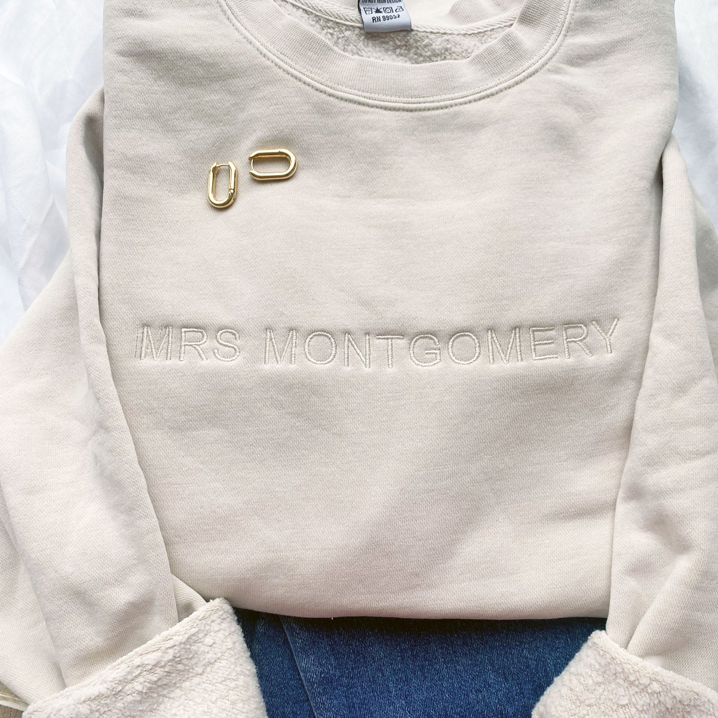 ivory vintage wash crewneck with custom minimal name embroidery across the chest