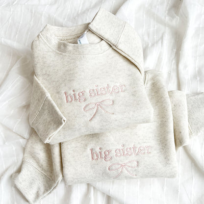 heather oatmeal crewneck sweatshirts with custom big sister bow embroidery in powder pink thread