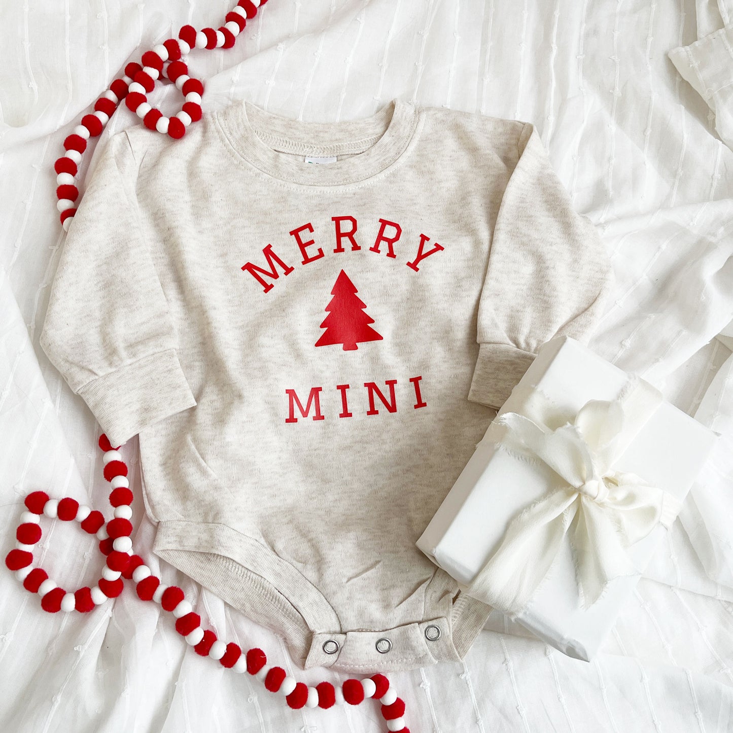 heather oat infant bubble romper with custom merry mini christmas tree printed design