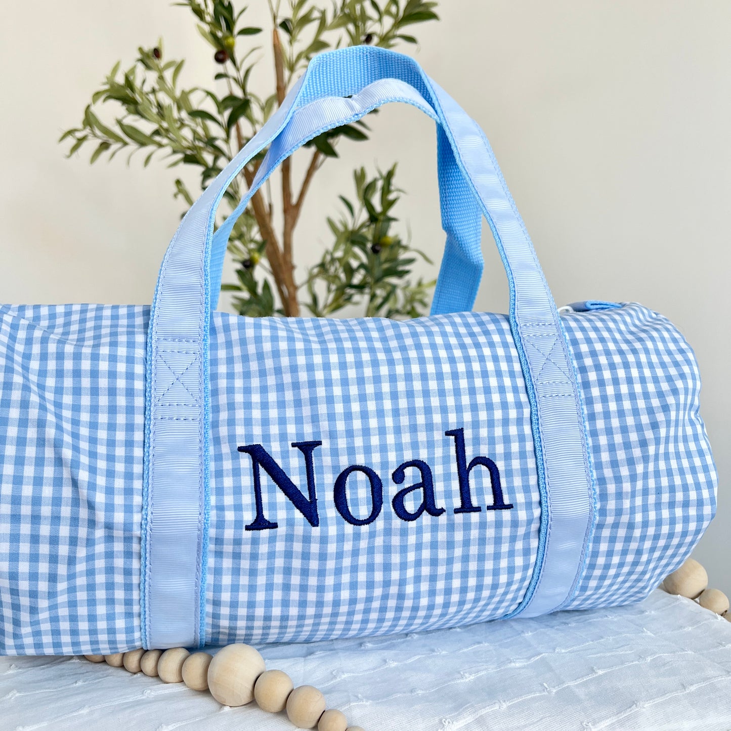 baby blue gingham duffle with custom navy name embroidery