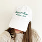 woman wearing a baseball cap with a classic mixed font embroidered stay at home moms club design
