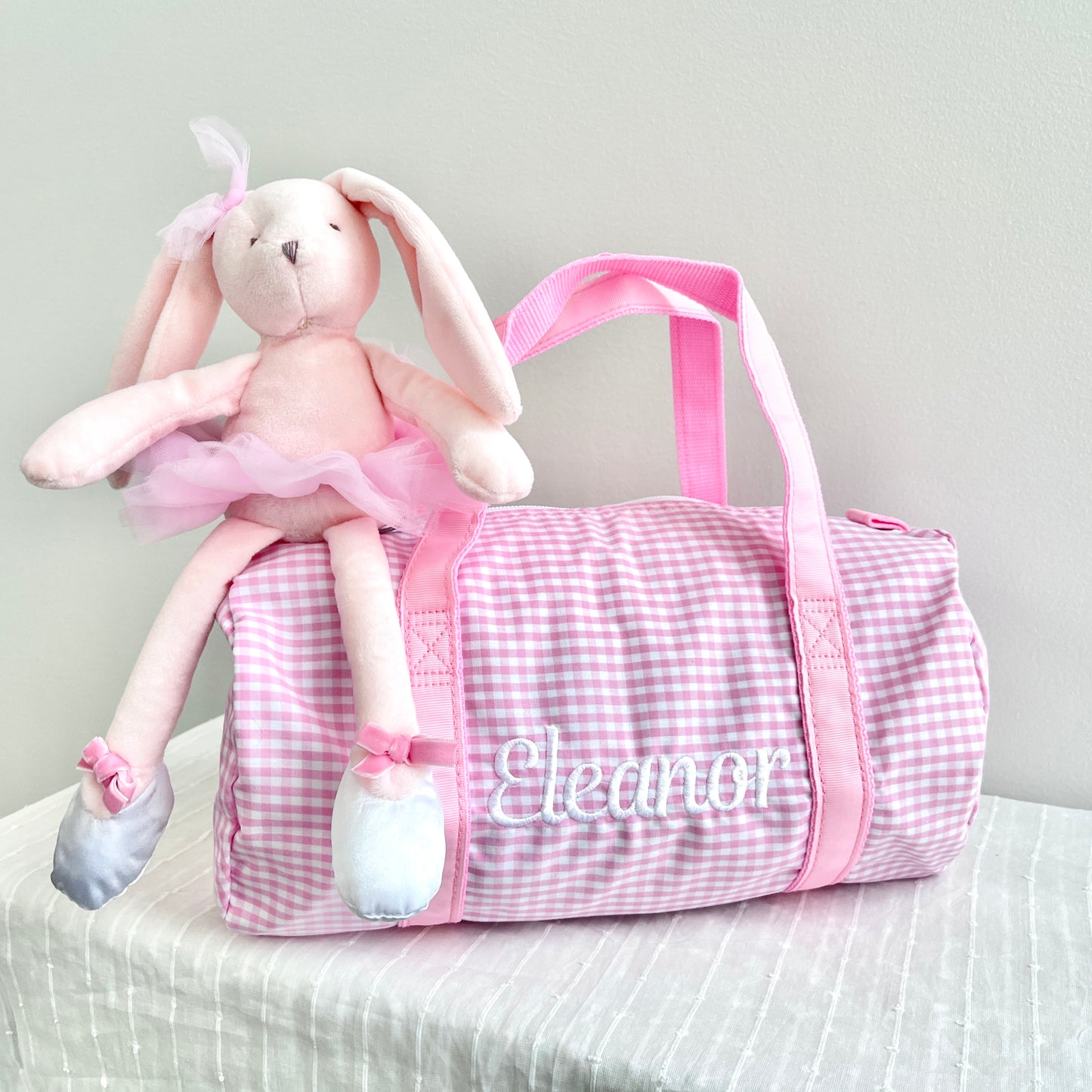 pink gingham duffle with custom white name embroidery