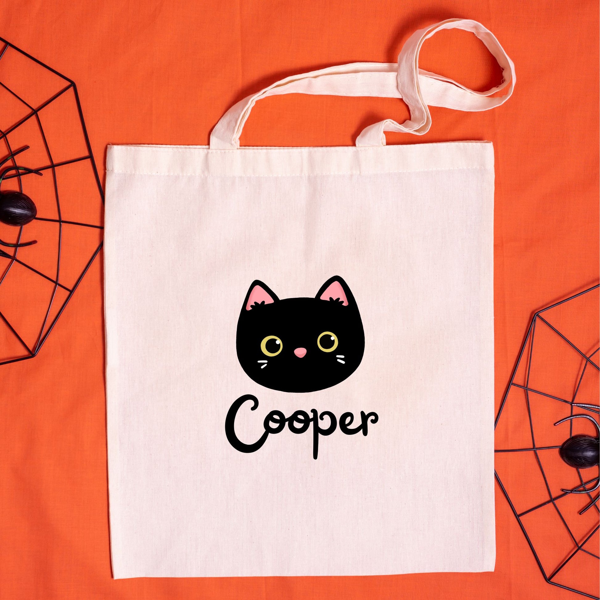 natural canvas trick or treat tote bag with custom black cat and name printed design