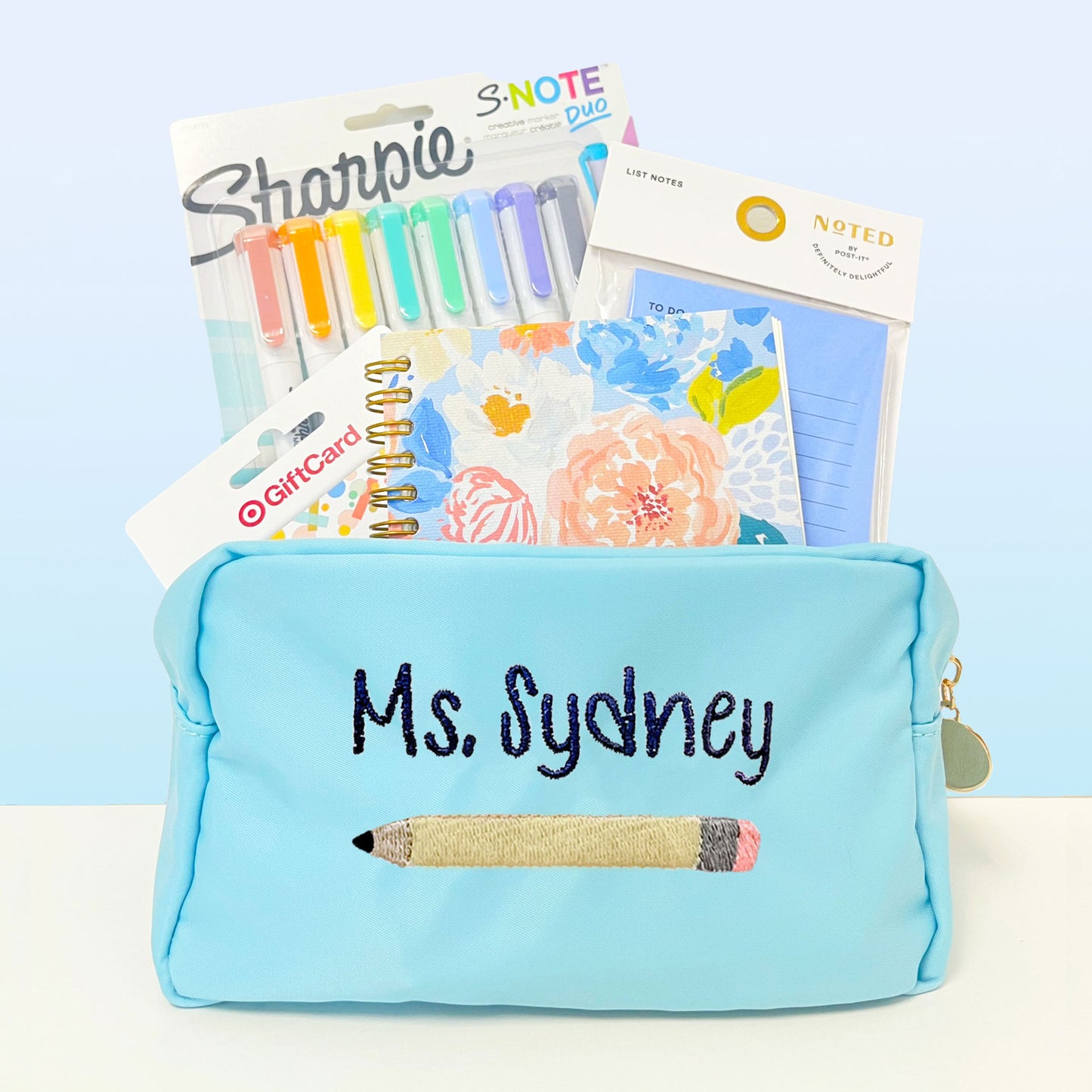 light blue pencil pouch with embroidered name and pencil design 