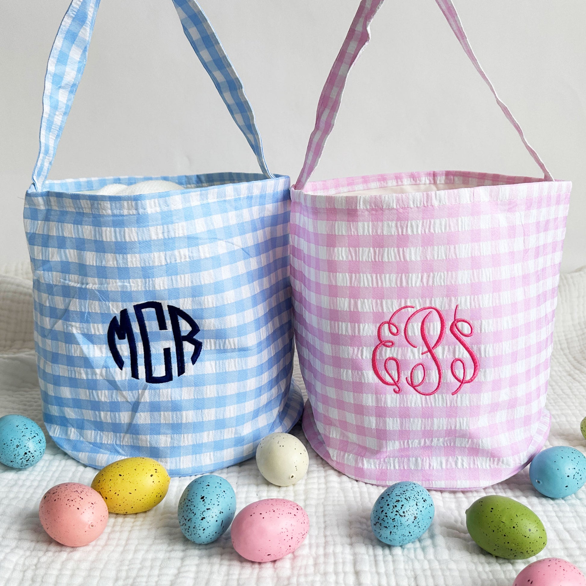 Blue and pink gingham easter baskets with custom 3 letter monograms embroidered on the center