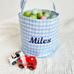 little boy's blue gingham easter basket with a custom name embroidered on the front