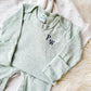 infant pj's with personalized two letter embroidered monogram in a navy blue