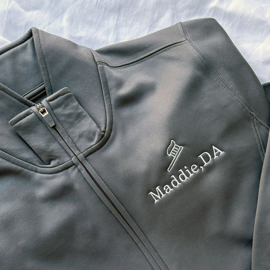 gray polyester full zip jacket with custom name and toothbrush embroidered design on the left chest