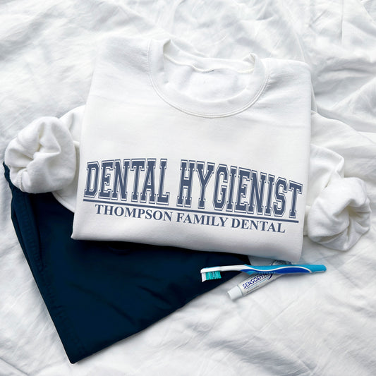 white sweatshirt with custom dental hygienist and practice name design 