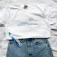 white t-shirt with dental assistant, large toothbrush, and custom name printed large in the center