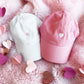 pink and white baseball hats with embroidered hearts for valentines day