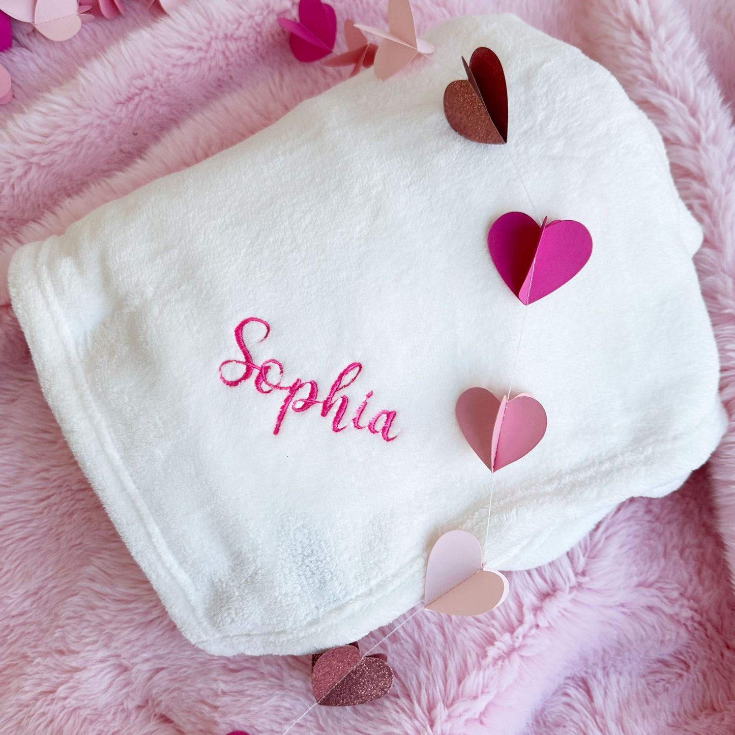 White blanket with sophia embroidered in pink 