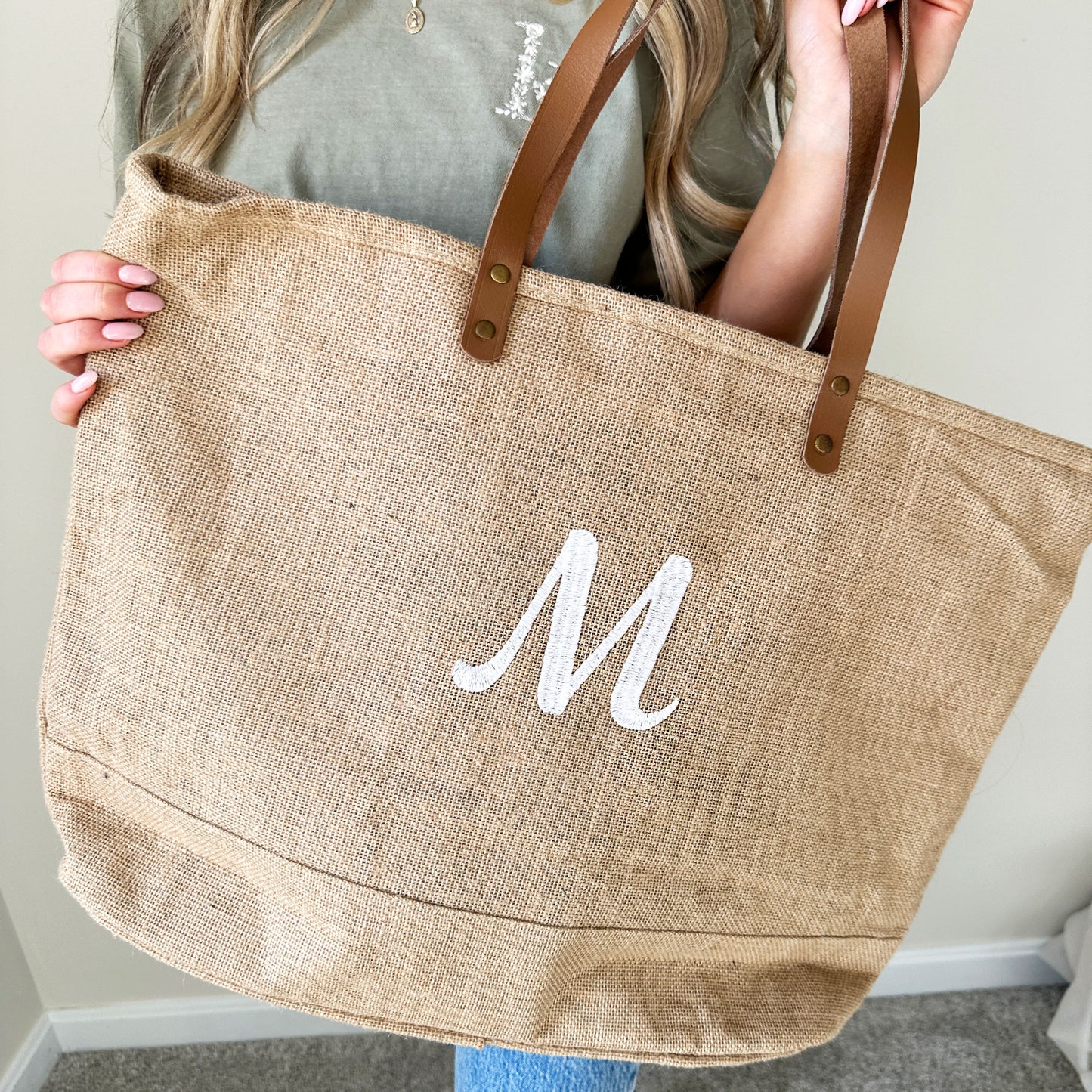 natural jute tote bag with a custom embroidered single initial
