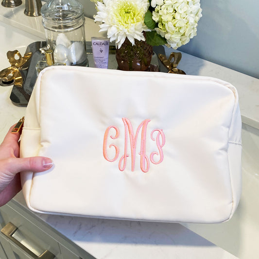 creme nylon cosmetic bag with custom three letter monogram embroidery