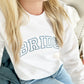 close up of a woman wearing a white sweatshirt with a varsity block BRIDE embroidered design on the front