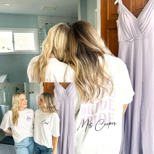 bride and her bridesmaid wearing matching oversized white t-shirts with custom wavy bride print in a lilac ink and custom script printed mrs. name