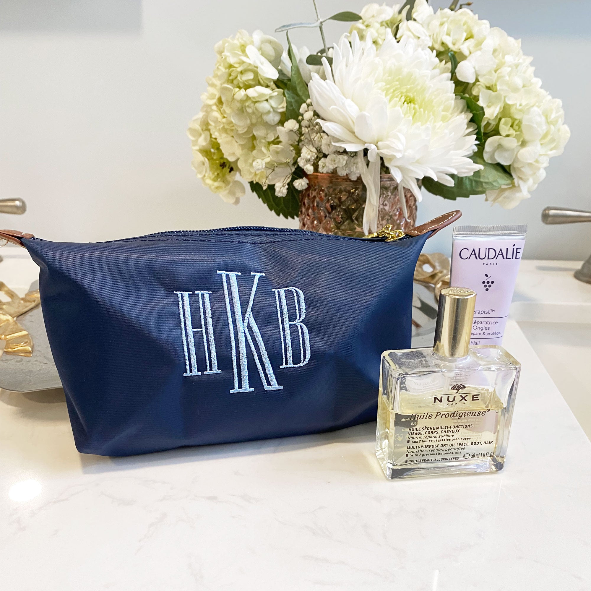 navy monogrammed makeup pouch